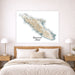 Map of Vancouver Island on a wall above a bed in a bedroom.