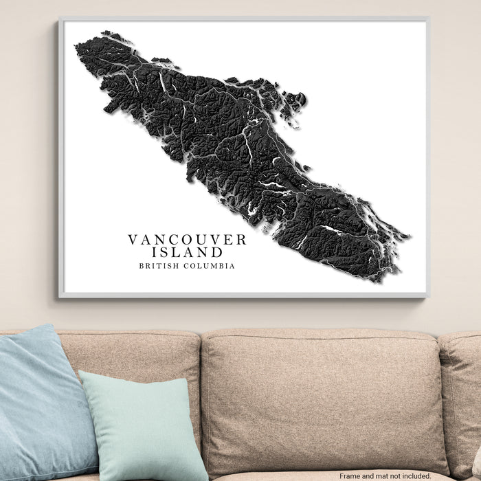 Map of Vancouver Island, British Columbia on a wall above a sofa.