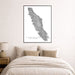 Framed map of Vancouver Island above a bed in a bedroom