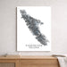 Map of Vancouver Island on a white wall above a wooden surface
