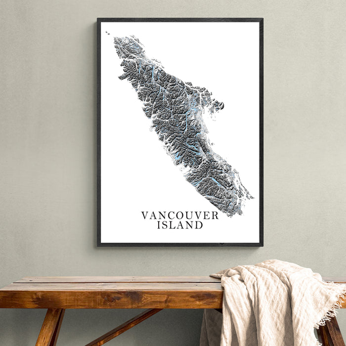 Framed map of Vancouver Island on a wall above a wooden bench.