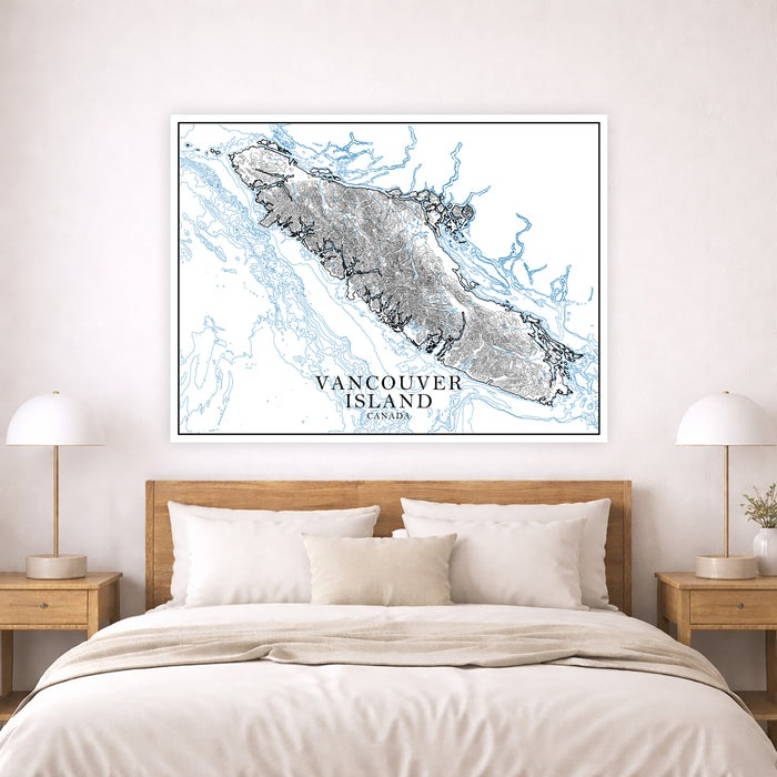 Framed map of Vancouver Island above a bed in a bedroom