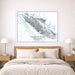 Framed map of Vancouver Island above a bed in a bedroom
