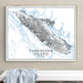 Framed map of Vancouver Island, Canada on a wall above a white surface.
