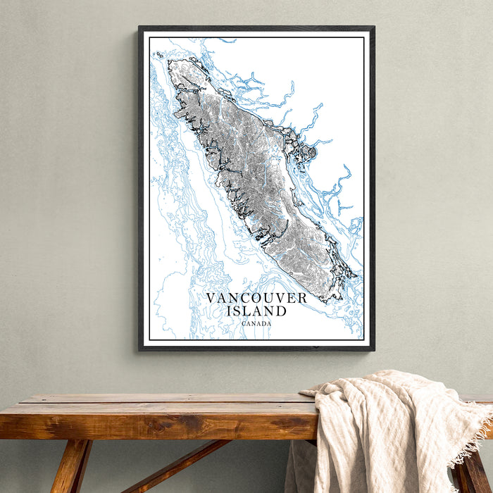 Framed map of Vancouver Island on a wall above a wooden bench.