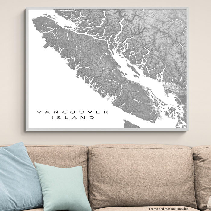 Map of Vancouver Island on a wall above a beige sofa with light blue pillows.