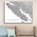 Map of Vancouver Island on a wall above a beige sofa with light blue pillows.