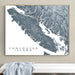 Framed map of Vancouver Island on a wall above a white surface.