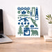Decorative wall art with Vancouver Island nature-themed icons on a white background, placed on a wooden desk.