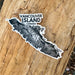 Map sticker of Vancouver Island, Canada on a wooden surface