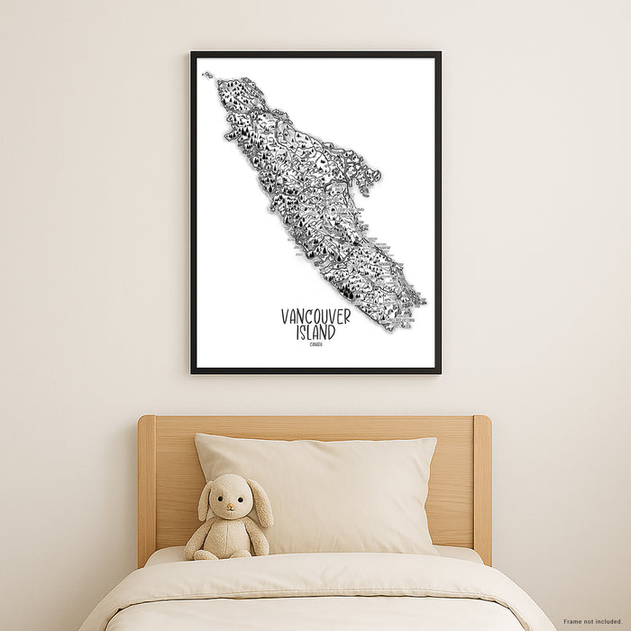 Framed map of Vancouver Island above a bed with a plush toy and pillows.