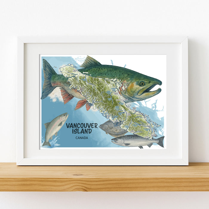 Framed map of Vancouver Island with salmon illustration on a white wall.