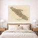 Map of Vancouver Island on a wall above a bed in a bedroom.