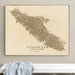Framed map of Vancouver Island, Canada on a wall above a white surface.