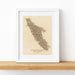 Framed map of Vancouver Island on a white surface