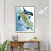 Framed map of Vancouver Island with orca whales on a wall above a desk.