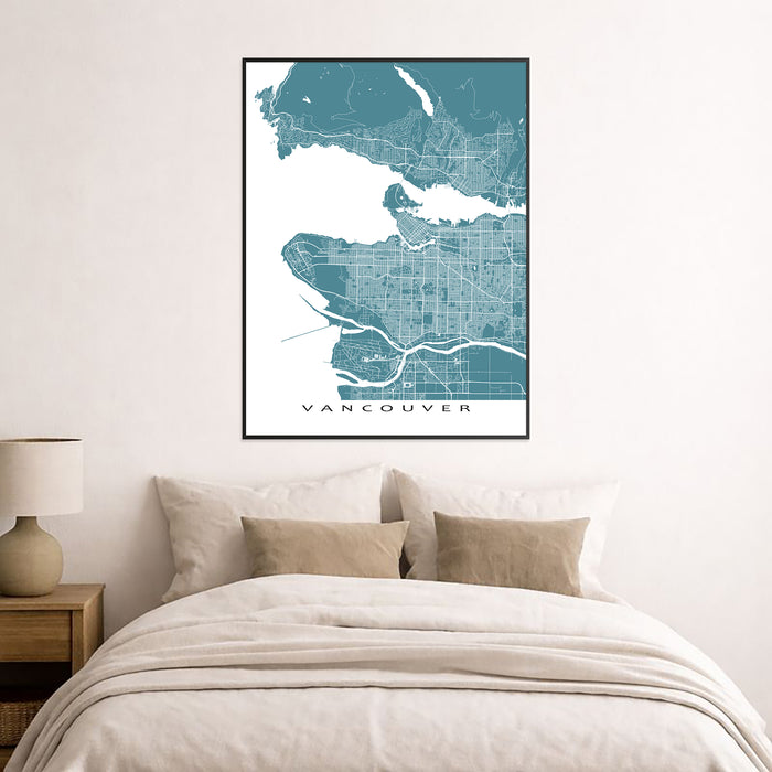 Framed map of Vancouver on a wall above a bed