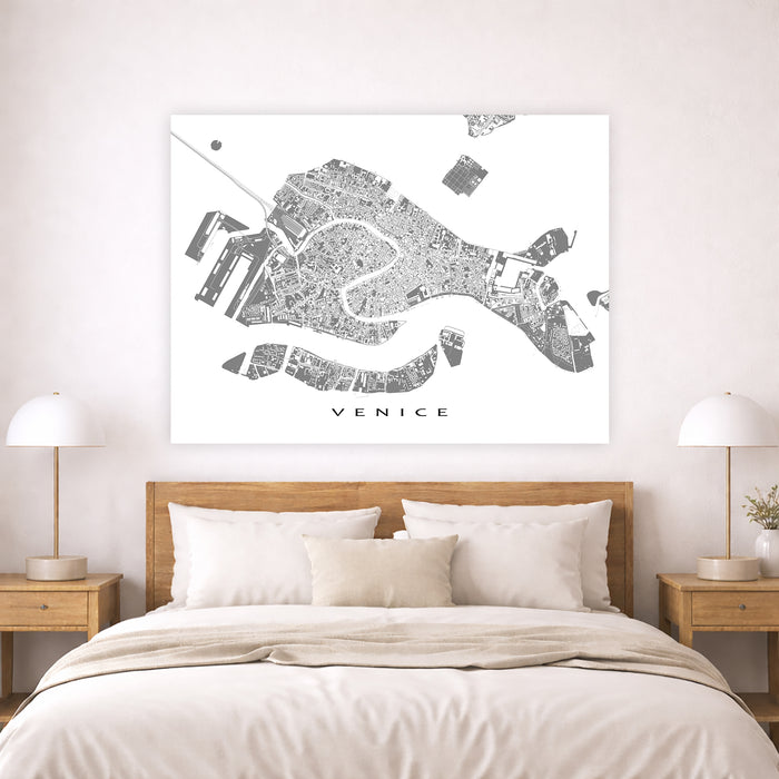 Map of Venice on a wall above a bed in a bedroom