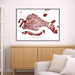Framed map of Venice on a wall above a wooden cabinet and white sofa.