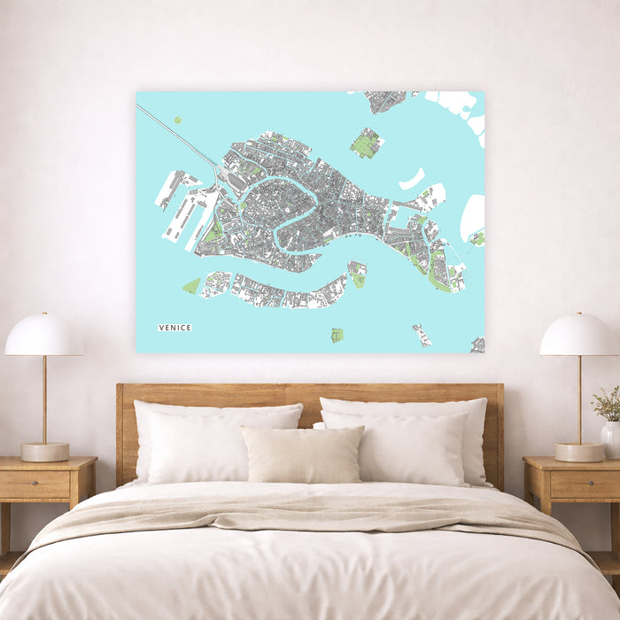 Map of Venice on a wall above a bed in a bedroom