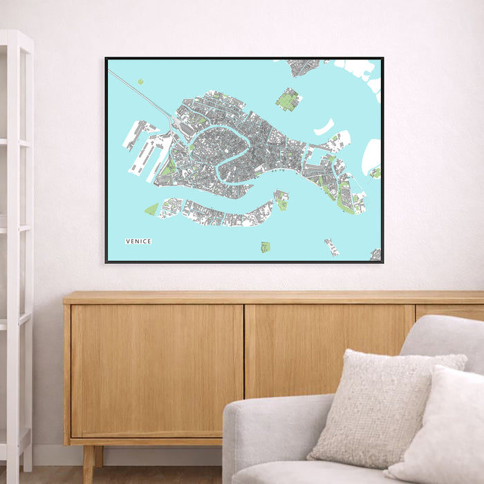 Framed map of Venice on a wall above a wooden cabinet and sofa.
