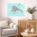 Living room with a map of Venice on the wall, a beige armchair, wooden cabinet, and small table.