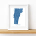 Framed map of Vermont on a white wall