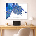 Map of Victoria on a wall above a desk with a laptop and lamp.
