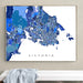 Framed map of Victoria on a wall above a white surface with a gray towel.