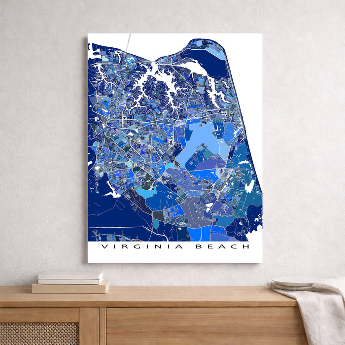 Map of Virginia Beach on a white wall above a wooden surface