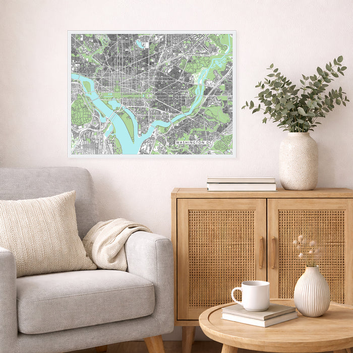 Living room with a city map on the wall, a couch, and a wooden side table with decor items.