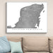 Framed map of Yucatan Peninsula on a wall above a sofa