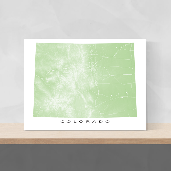 Colorado state map print with natural landscape and main roads in Sage designed by Maps As Art.