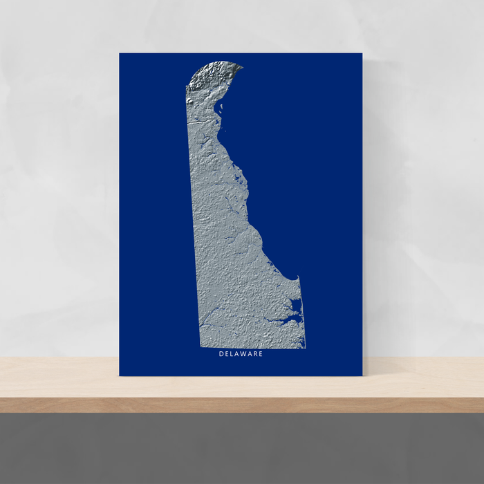Delaware state map with natural landscape in greyscale and a navy blue background designed by Maps As Art.