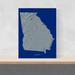 Georgia state map print with natural landscape in greyscale and a navy blue background designed by Maps As Art.