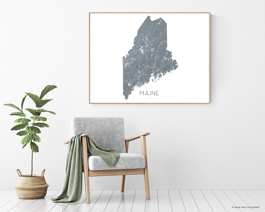 Maine state map print with chair and plant home decor by Maps As Art.