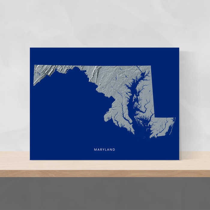 Maryland state map print with natural landscape in greyscale and a navy blue background designed by Maps As Art.