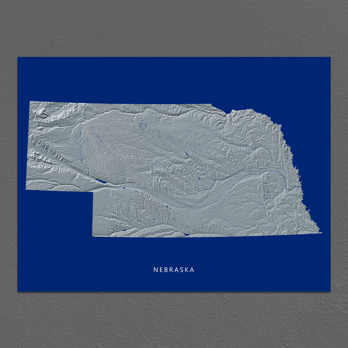 Nebraska state map print with natural landscape in greyscale and a navy blue background designed by Maps As Art.