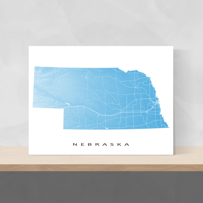 Nebraska state map print with natural landscape and main roads in Malibu designed by Maps As Art.