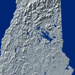 New Hampshire state map print with natural landscape in greyscale and a navy blue background designed by Maps As Art.