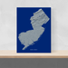 New Jersey state map print with natural landscape in greyscale and a navy blue background designed by Maps As Art.