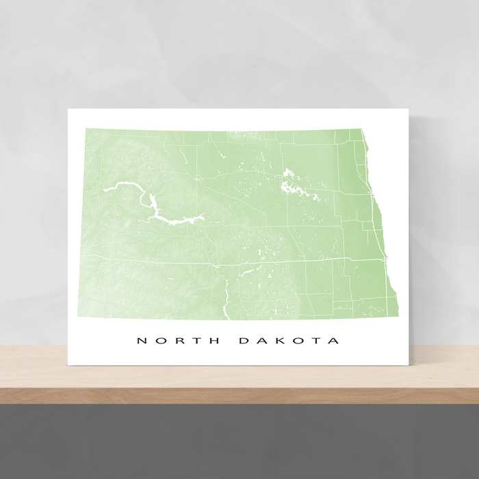 North Dakota state map print with natural landscape and main roads in Sage designed by Maps As Art.