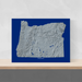 Oregon state map print with natural landscape in greyscale and a navy blue background designed by Maps As Art.