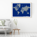 World map print with natural landscape in greyscale and a navy blue background designed by Maps As Art.